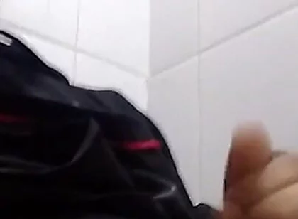 Man Sits in the Bathroom