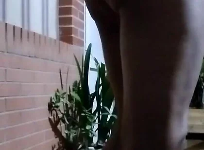In the Doorway in a Thong and with an Anal Plug