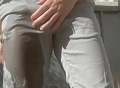 Jules Wets His Grey Pants and Exposes His Semi-hard Cock Through His Trousers