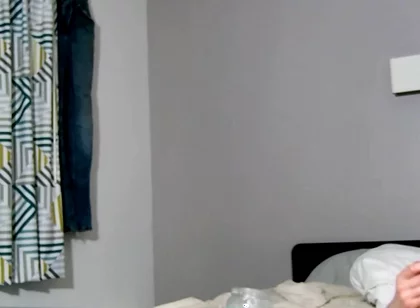 On Bed Laying Down with Socks and Beater on