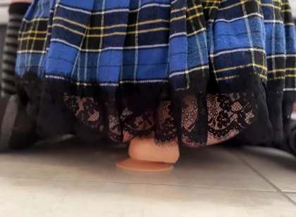 Riding a dildo in a miniskirt