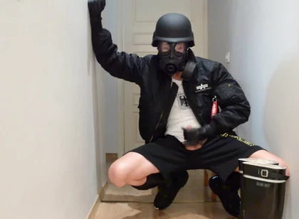 Gas masked guy cums on his rubber boots