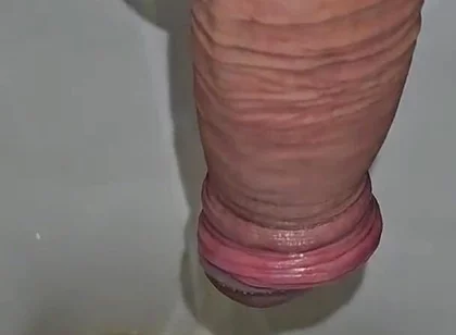 Male Peeing Into the Toilet