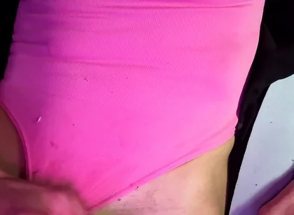 Crossdresser Michelle Wearing Pink Bodysuit While Playing with Cock