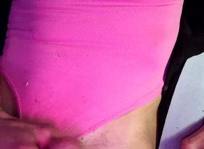 Crossdresser Michelle Wearing Pink Bodysuit While Playing with Cock