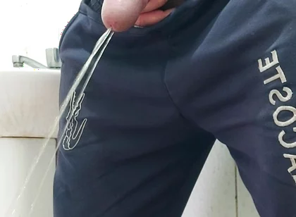 A Well-endowed Brazilian Man Urinating and Showing His Thick Penis to His Female Friends.