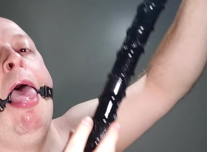 Deepthroating an 18 Inch Dildo with Mouth Gag Ring