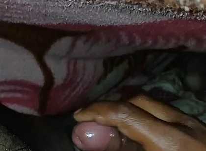 Big Boss massaging penis oil under the blanket