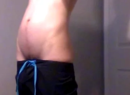 Young Guy Fills His Stomach with Water