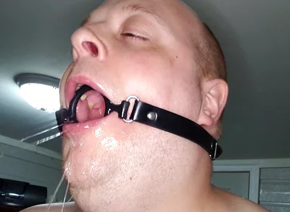 Deepthroating a 7 Inch Dildo with Mouth Gag Ring
