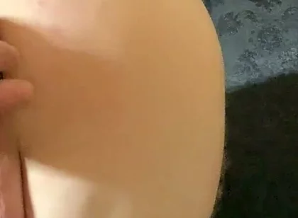 A Crossdresser in Leggings and a Seductive Bodysuit Plays with Ass