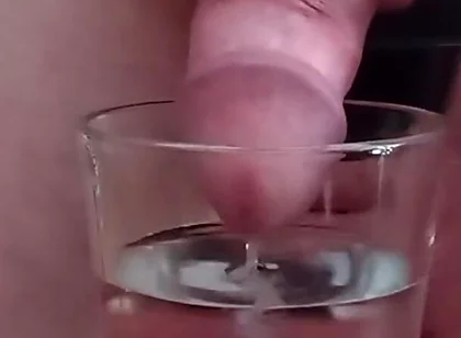 Cumming in a glass of hot water