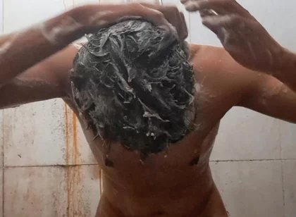 Exotic Skinned Adult Man Taking a Bath in the Afternoon