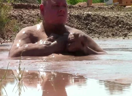 Deep, Creamy Brown Mud Bath in a Sand Pit