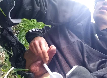 Gay boy Jon Arteen, wearing adidas tracksuit Campus sneakers, gets a hard-on outdoors