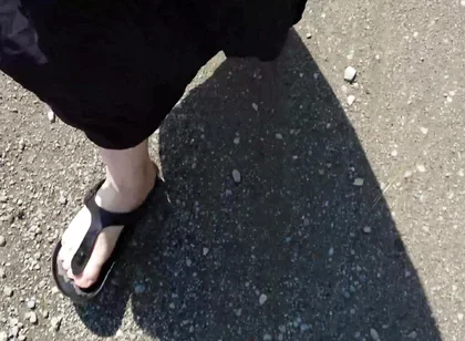 Outdoor in a Black Caftan and Barefoot in Black Birkenstocks
