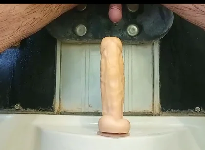Mulatto Jumps on a Dildo and Pisses
