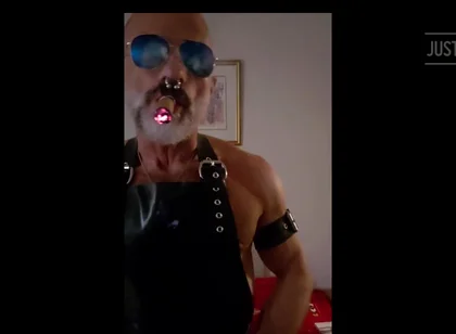 Stepdad lighting his Cigar in rubber apron