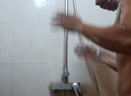Exotic Skinned Asian Adult Man Taking a Shower in the Morning